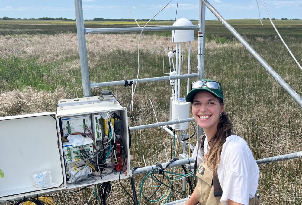 Jenna collecting data from a field site in Manitoba 